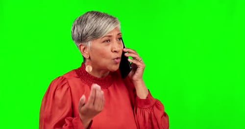 Phone call, anger and senior woman on green screen for conversation, talking and discussion