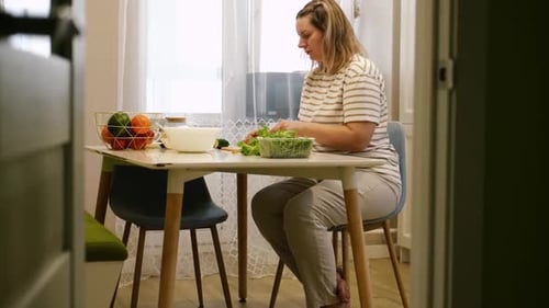 Vegetable Fresh Salad Woman Cooking a Green Salad with Cucumbers Onion Lettuce Pepper and Tomatoes