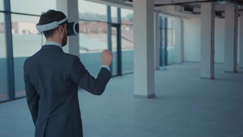 Man in VR Headset Interacts in Empty Office