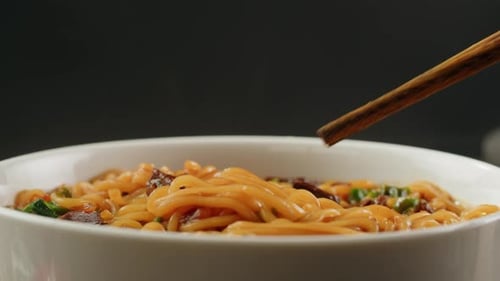 Bowl of Delicious Asian Noodles with Chopsticks