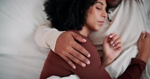 Couple Cuddling and Sleeping Together Peacefully in Bed