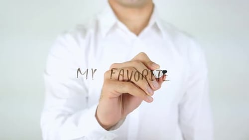 Hand Writes My Favorites on Clear Surface