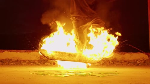 Flaming Skateboard Kicked onto Glass Shards at Night