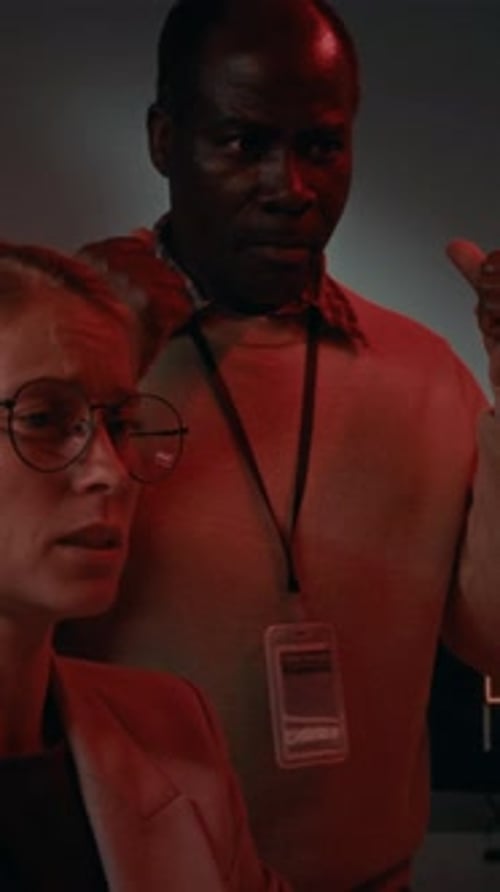 Two Adults Having a Heated Office Discussion at Night