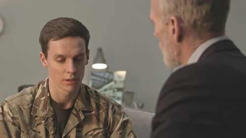 Soldier Talking with Counselor in Living Room
