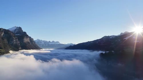 Swiss Alps sunrise above cloud inversion valley