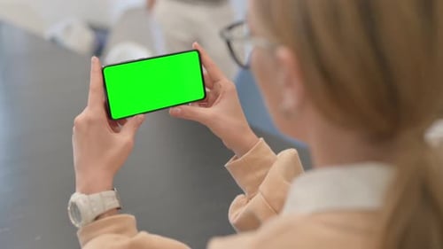 Woman Holding Phone Horizontal with Chroma Key Screen