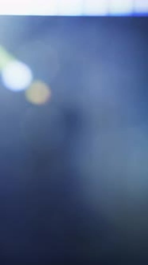 Lens Flare Shining Brightly On The Top Left Of A Dark Backdrop