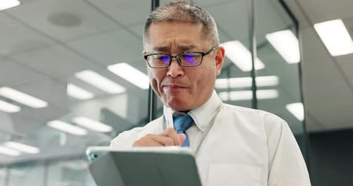 Business, tablet and thinking with mature man in office for corporate planning or problem solving