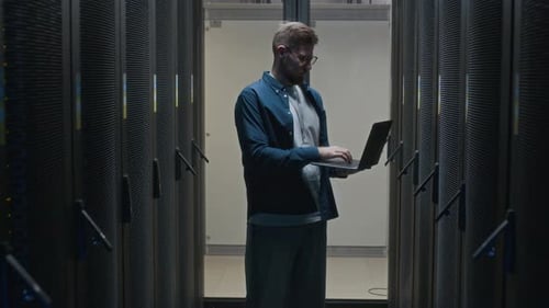 Skilled Male Data Center Specialist Checking Work of Hardware
