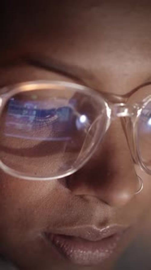 Woman With Glasses Looking At A Computer Screen