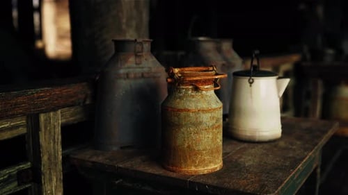 Rustic Milk Cans and Kettle in Old Barn Setting
