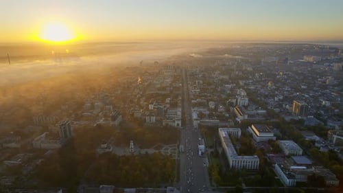 Aerial drone view of Chisinau at sunrise, Moldova. View of city centre covered with fog. Central Par