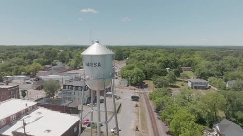 Water tower of Louisa, Virginia and drone video moving in a circle to downtown area.