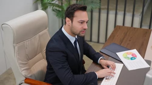 Well Dressed Man Typing on Wireless Keyboard
