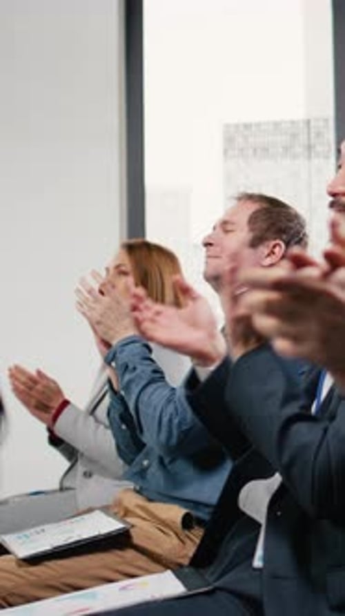 Business People Applauding in Office Meeting Space