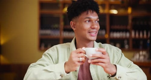 Drinking coffee, thinking and happy man in cafe for relax, espresso and latte in restaurant shop