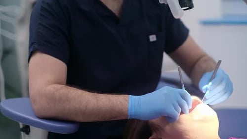 Professional Dentistry Services in Clinic Doctor in Rubber Gloves Holding Sterile Dental Tools