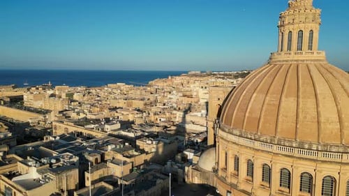 Aerial drone view of the walled city of Valletta, Malta, surrounded by the Mediterranean sea in dayl