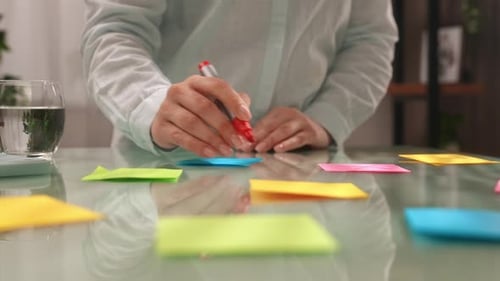 Colorful Sticky Notes with Ideas on Table Surface