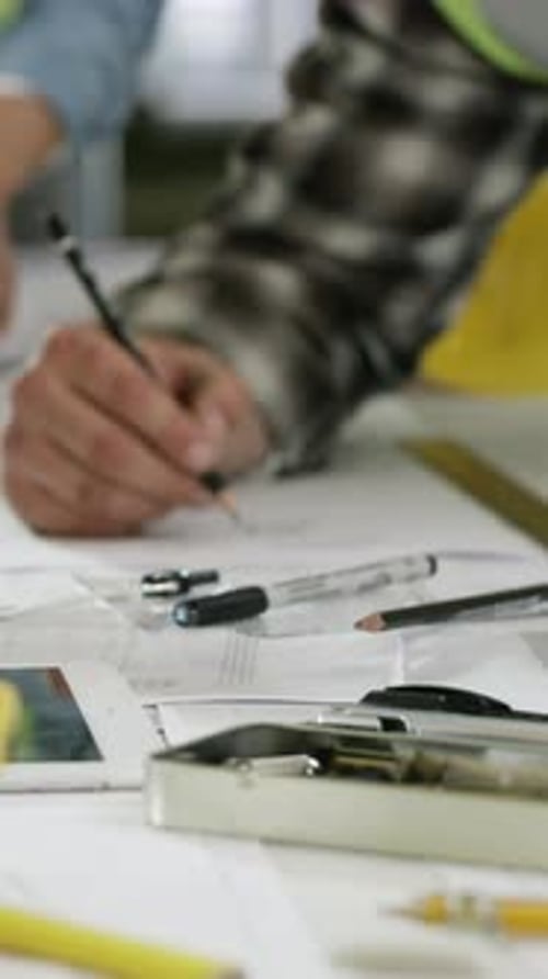 Team, construction and blueprint with hands of people for building, inspection or expansion