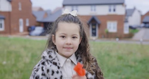 Authentic mixed race smiling girl portrait at park