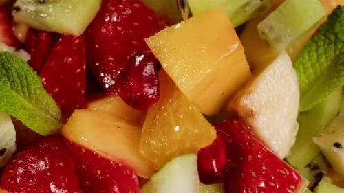 Close-up of Colorful Fresh Fruit Salad with Fork