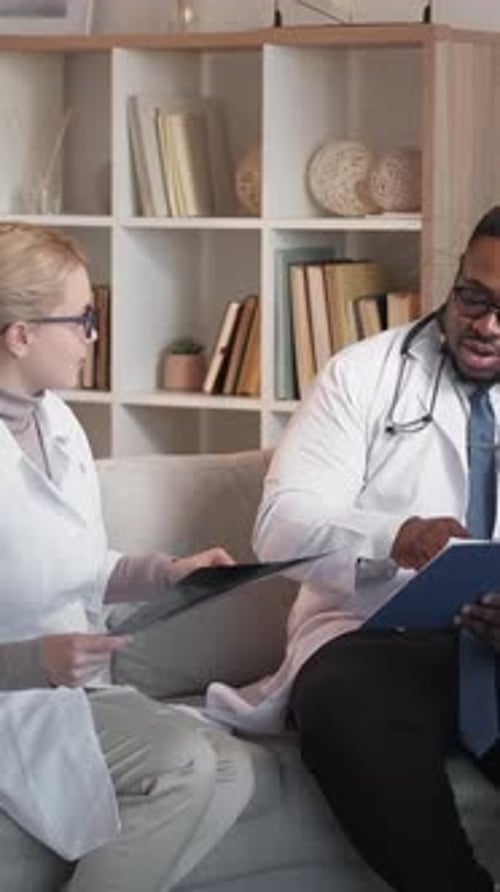 Doctors Discussing X-Ray Results in Office