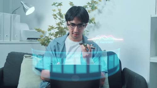 Man Uses AI Assistant with Laptop and Phone