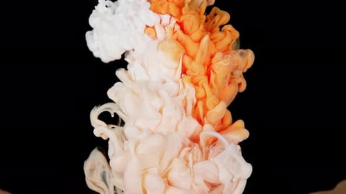 Yellow and White Paint Top View Blending in the Water in Slow Motion Ink Liquid Underwater on Black