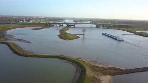 drone footage of the boat approaching the bridge in 4K in Holland