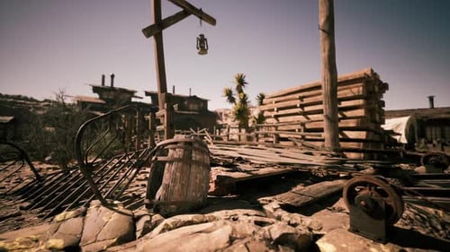 Abandoned Western Town with Wooden Structures and Dusty Atmosphere in Daylight