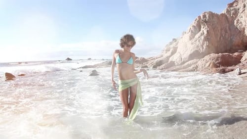 Woman Dancing on the Beach