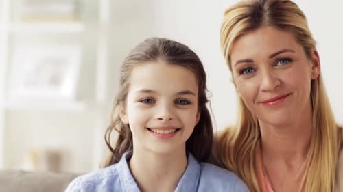 Happy Mother and Daughter Smiling at Camera