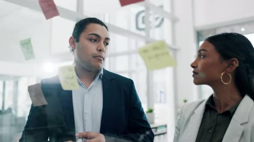 Glass wall, teamwork and business people planning, schedule and strategy in office