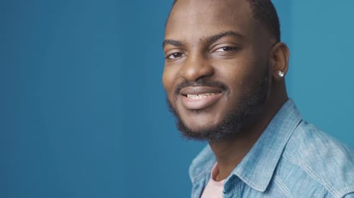 Man smiling in close up looking at the camera