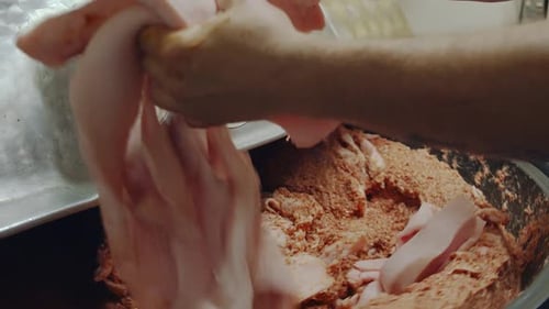 Meat Being Processed in Large Machine