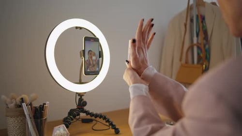Vlogger Hands Demonstrating Cosmetics at Studio Closeup Woman Filming Tutorial