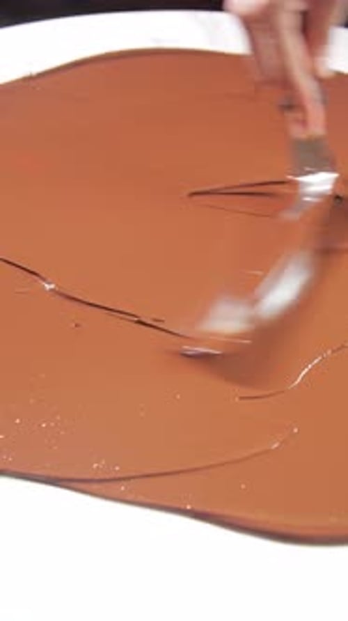 Mixing Chocolate for Signature Desserts in a Restaurant Haute Cuisine and Pastry Concept Vertical