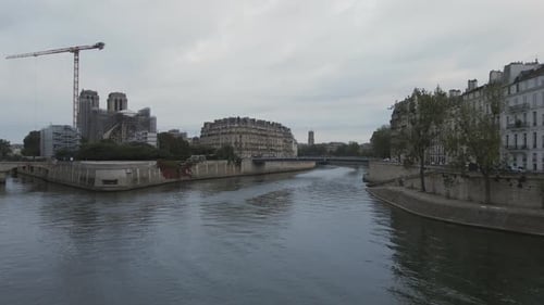 Flying low over the Seine toward the backside of Notre Dame in Paris
