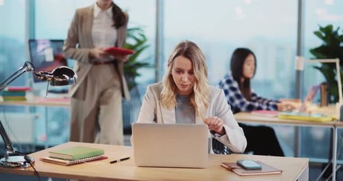 Couple of Female Executives Cooperating in Coworking Office Blonde and Brunette Women Colleagues