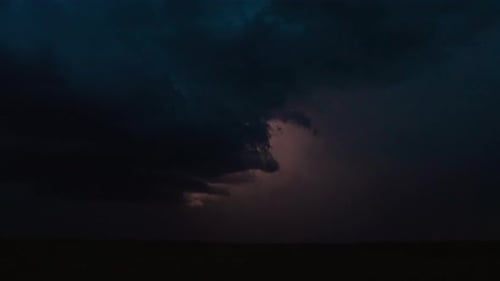 Dramatic Lightning Storm Over Dark Field at Night