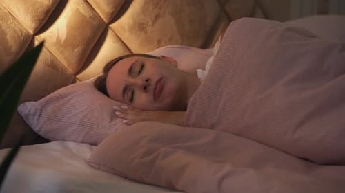 A Woman Like in Bed Unable to Sleep Tossing and Turning Under Her Blanket Difficulties of Falling