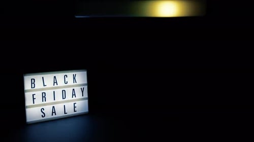 Black Friday Sale Sign Glowing on Dark Background