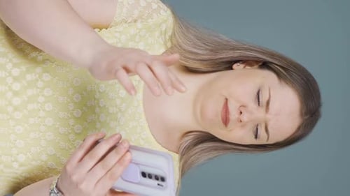 Concerned Young Woman Using Smartphone Portrait