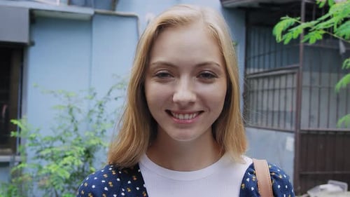 Portrait of Beautiful Tourist Girl Smiling at Camera on Bangkok Asian Street