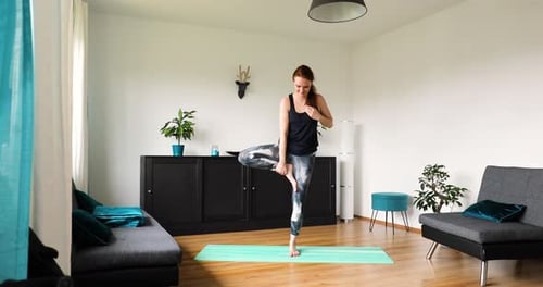 Woman Practicing Yoga Poses in a Bright Home