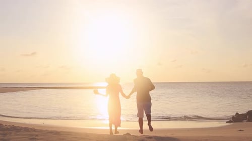 Tourist Couple Out Of Joy Run On Maldivian Beach