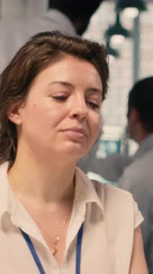 Vertical Video Female Professional Reviewing Monetary Data and Taxes for Compliance