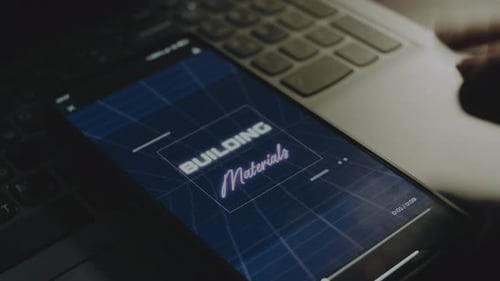 Building Materials Inscription on Smartphone Screen Construction Concept Male Hand Flapping with